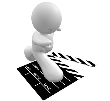 Guy icon surfing on film scene clap board